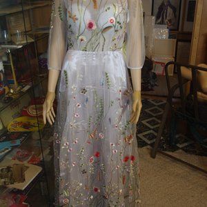 SHEAR SEE THRU TOP WITH FLOWERED VINE APPLIQUE OVER SILVER UNDERGARMENT